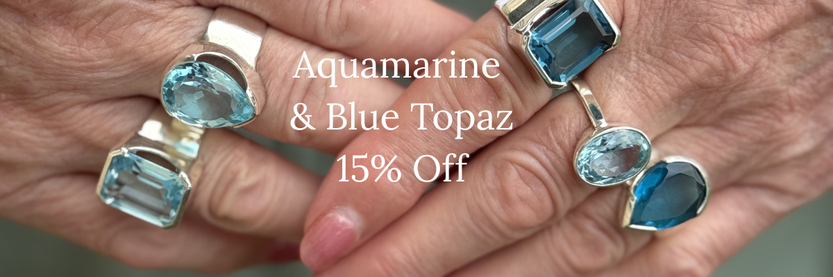 Hands wearing rings with aquamarine and blue topaz stones, with promotional text overlay.