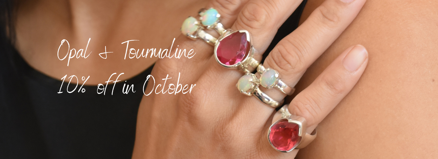 Opal rings and pink tourmaline ring. Birthstone for October in Australia
